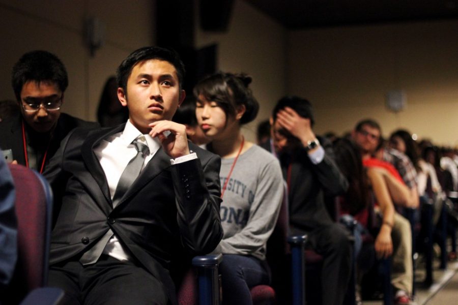 Rebecca Marie Sasnett/ The Daily Wildcat

Richie Bui, a molecular and cellular biology senior, waits for espisode one of of season 4 of usa Network's TV Suits in the Gallagher Theater on Tuesday night in a daper suit. UA is the third stop in the Suits College Tour hosted by usa Network. 