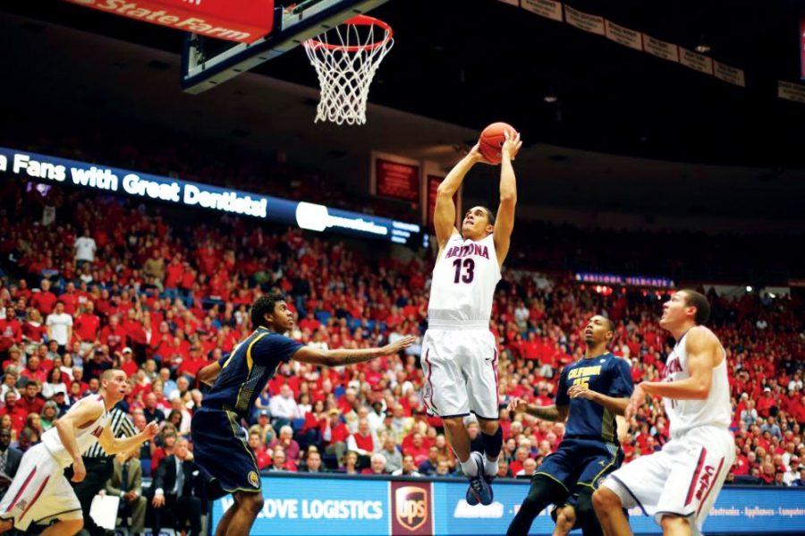 	Junior guard Nick Johnson jumps for a shot during Arizona’s game against California on Wednesday in McKale Center. The Wildcats beat the Golden Bears by 28 points.