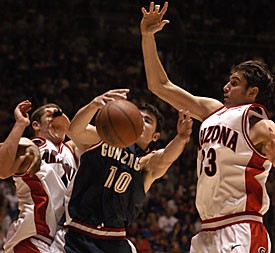 	Arizona’s Luke Walton and Rick Anderson attempt to rebound a missed shot over Gonzaga’s Blake Stepp. Arizona defeated Gonzaga 96-95 in double overtime during the second round of the NCAA tournament in Salt Lake City on March 22, 2003.