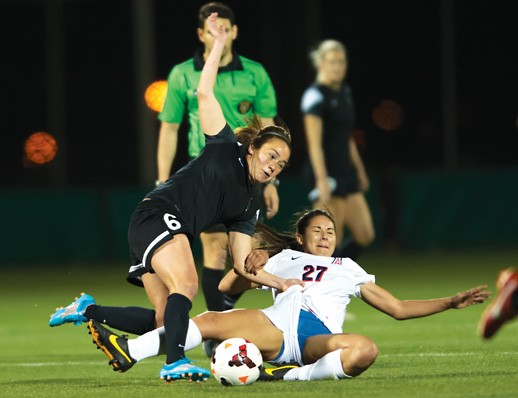 Carlos Herrera / The Daily Wildcat

Freshman midfielder Laura Pimienta (27) falls to the grass as Meleana Shim (6) runs to obtain the ball for the Portland Thorns. UA Womens Soccer fell to the professional Portland Thorns FC 10-0 on Friday at the Kino Sports Complex.