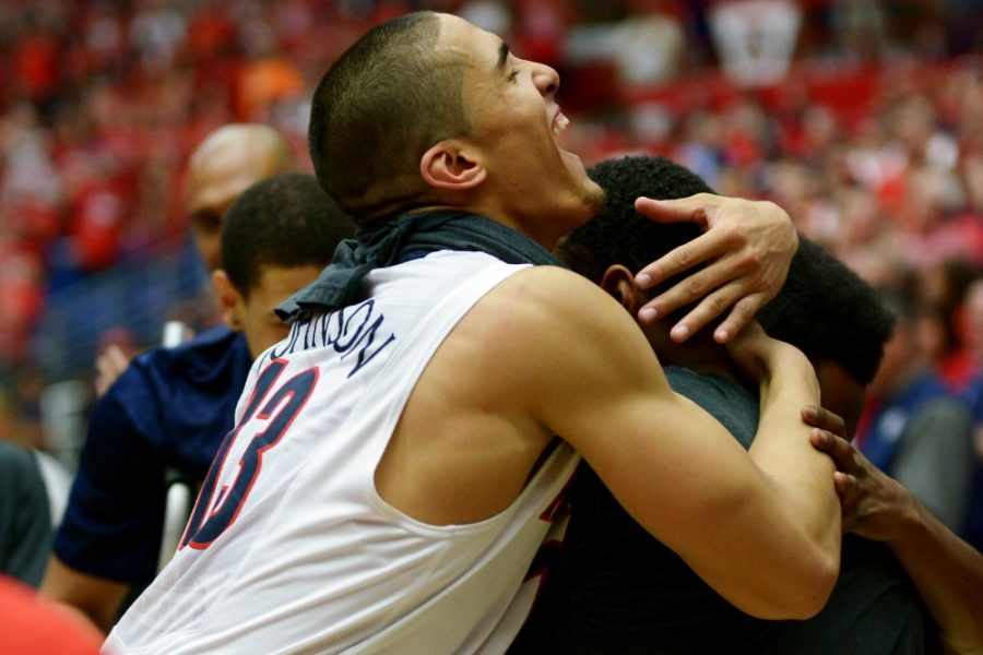 Tyler+Baker%2F+The+Daily+Wildcat%0A%0AJunior+guard+Nick+Johnson+hugs+senior+guard+Jordin+Mayes+before+Mayes+accepts+his+framed+jersey+during+senior+night+in+McKale+Center.+