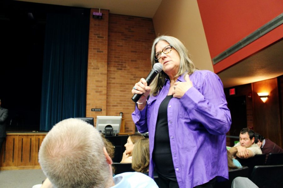 	Alison Deming, director of the creative writing program, addresses concerns regarding a proposal to move the Department of English to the College of Social and Behavioral Sciences on Wednesday in the Modern Languages building. Faculty and staff in the department are voting on the proposal this week. 