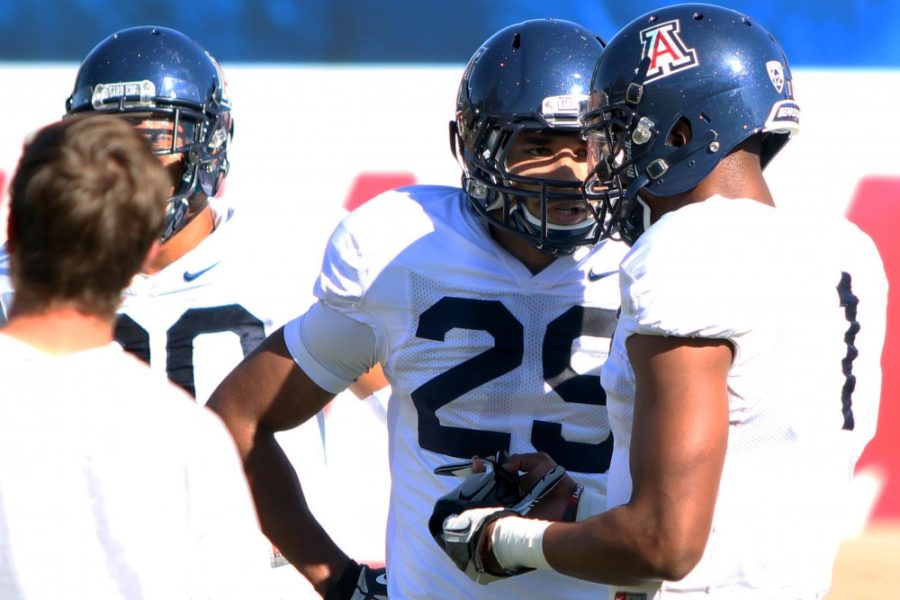 	Arizona redshirt senior receiver Austin Hill (29) talks to Arizona redshirt sophomore receiver Cayleb Jones (1) in between drills during practice at Jimenez Practice Facility on March 10. Hill is one of five UA athletes to watch this upcoming season. 