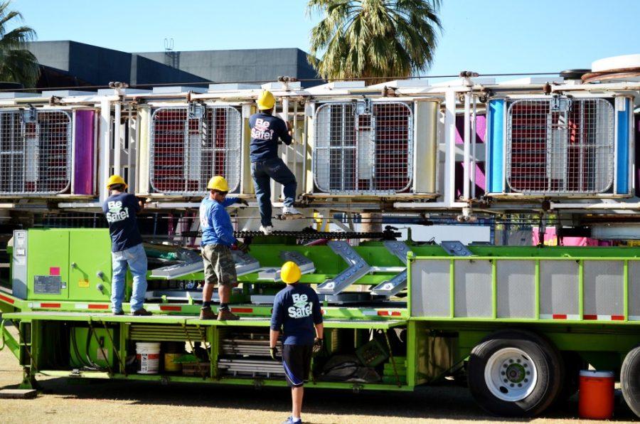 Devin Means / The Daily Wildcat

RCS construction workers unload and set up carnival rides for the upcoming Spring Fling. Spring Fling is returning to the UA campus for the first time in 15 years.