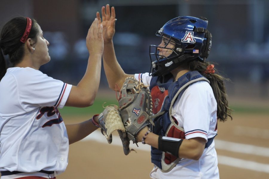 	<p>Sophomore Lauren Young (9) high-fives teammate Kelsey Rodriquez (24) after the Wildcats’ 13-3 five-inning win on Wednesday night over the New Mexico State Aggies. The Wildcats will put their 24-0 home record to the test this weekend when they host Utah.</p>