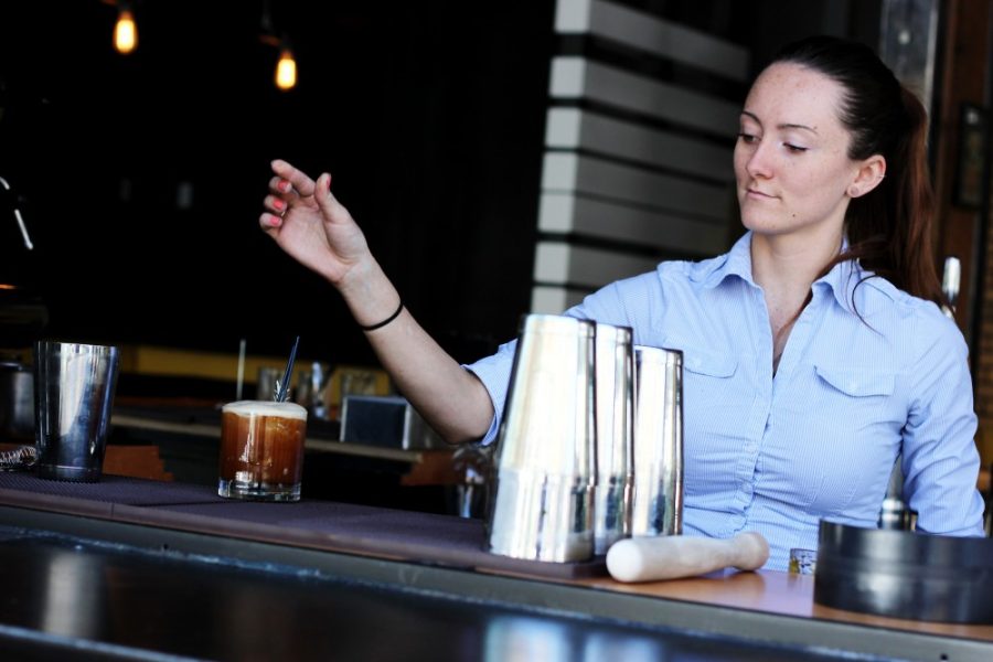 Sammi Sefton, bartender at Proper Tucson, makes Porch Tea on Thursday at the restaurant downtown. The cocktail is made with house-infused black tea vodka, citrus, rosemary and simple syrup.
