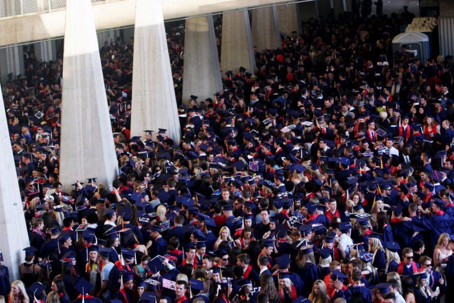 	Rebecca Marie Sasnett/ The Daily Wildcat
On the west side of Arizona Stadium, 4,000 graduates line up before the start of The University of Arizona’s 150th Commencement. Graduates complained of standing in hot, cramped conditions with little access to water.