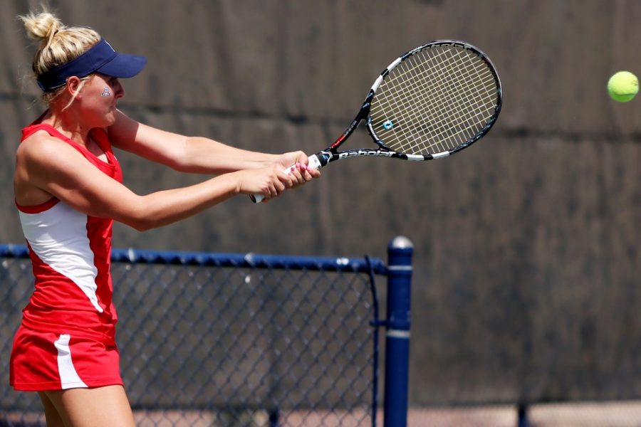 	<p>Arizona sophomore Shayne Austin hits the ball during the doubles match of Arizona’s 4-2 win against <span class=