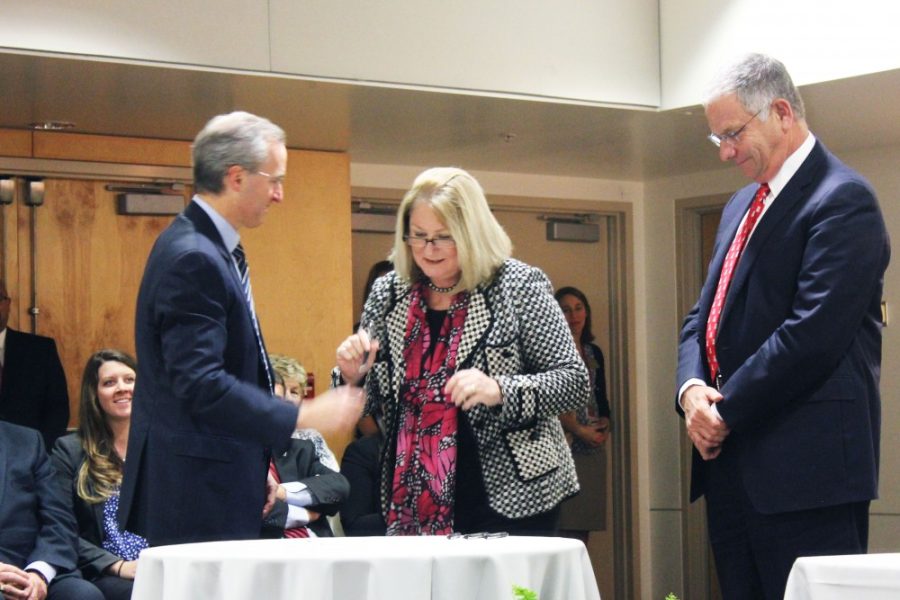 	UA President Ann Weaver Hart signs an agreement on Thursday in the Kiewit Auditorium of the Arizona Cancer Center in support of the Arizona Board of Regents decision to grant approval to a merger between the Phoenix-based Banner Health Center and the University of Arizona Health Network. 