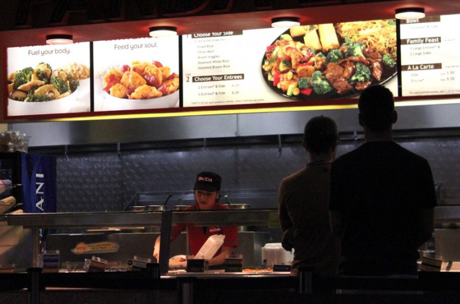 	Customers wait in line at Panda Express in the Studnet Union Memorial Center. The student union food court includes a Papa Johns, Chick-fil-A, On Deck Deli, IQ Fresh, Einsteins Bros. Bagels, Pinkberry and Burger King. 