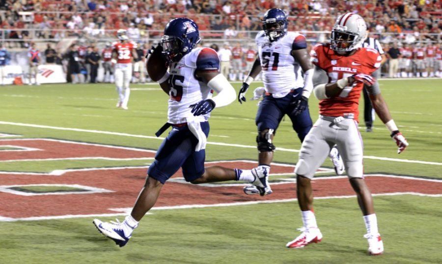 	Freshman linebacker Ryan Dunn (25) scores a touchdown during UA’s 58-13 win against UNLV on Sept. 7, 2013 at Sam Boyd Stadium. The two teams meet up again for the season opener in a nationally televised game on ESPN on Friday.
