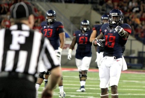 Arizona redshirt sophomore wide receiver DaVonté Neal (19) reacts to a pass interference call on UNLV during Arizona's season opener against UNLV at Arizona Stadium on Friday, Aug. 29, 2014. Arizona won 58-13 against UNLV. Anu Solomon broke the freshman passing yards record with 425 yards. 
Photo taken on Monday, Aug. 29, 2014. Photo by: Rebecca Marie Sasnett / The Daily Wildcat