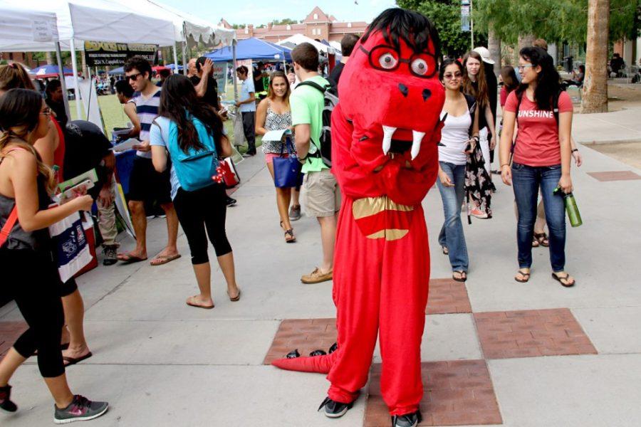 Cooper Temple/ The Daily Wildcat

A costumed dragon attracts prospective students during the club fair on the UA mall. This was one of the many interests and oddities shown off on campus, Tuesday, Aug. 26, 2014, in Tucson, Arizona. 