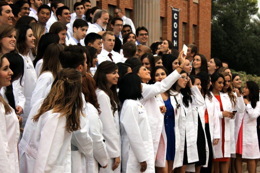 	The University of Arizona College of Medicine Tucson’s 21st annual White Coat Ceremony was held in Centennial Hall on Friday. Following the recessional, the new students gathered outside to take a group
photograph. 