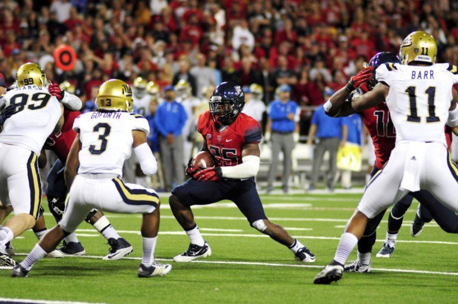 %09Former+Arizona+running+back+Ka%26%238217%3BDeem+Carey+runs+with+the+ball+during+the+UA%26%238217%3B+s+31-26+loss+against+UCLA+on+Nov.+9%2C+2013+at+Arizona+Stadium.+UCLA+starting+QB+Brett+Hundley+injured+his+elbow+on+Saturday%2C+and+the+Bruins+took+over+first+place+in+the+Pac-12+Conference+south+divsion+in+this+week%26%238217%3Bs+Pac-12+power+rankings.+