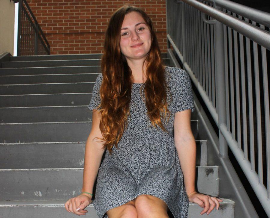 	Olivia Bradley, a junior English major, sits on stairs at the Student Union Memorial Center on Friday. Bradley will spend the full academic year in Tucson before returning to her hometown in Birmingham, England.