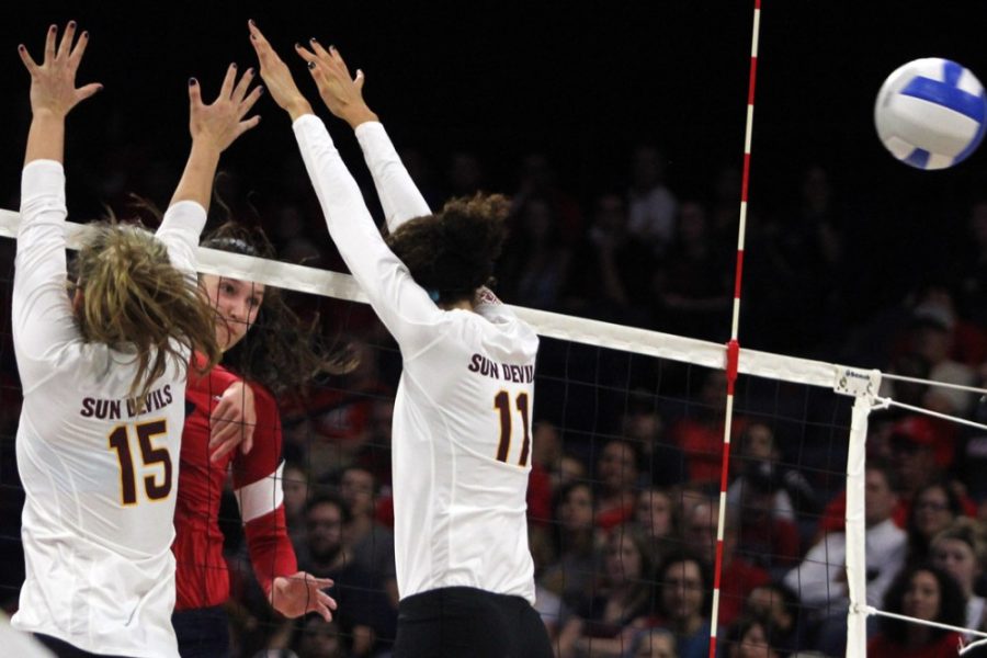 %09Arizona+sophomore+outside+hitter+Ashley+Harris+%2817%29+spikes+the+ball+between+ASU+junior+middle+blocker+Andi+Lowrance+%2815%29+and+ASU+sophomore+outside+hitter+BreElle+Bailey+%2811%29+during+Arizona%26%238217%3Bs+win+over+the+Sun+Devils+on+Wednesday+in+McKale+Center.+The+Wildcats+play+UCLA+on+the+road+in+their+first+Pac-12+Conference+road+game+of+the+season.