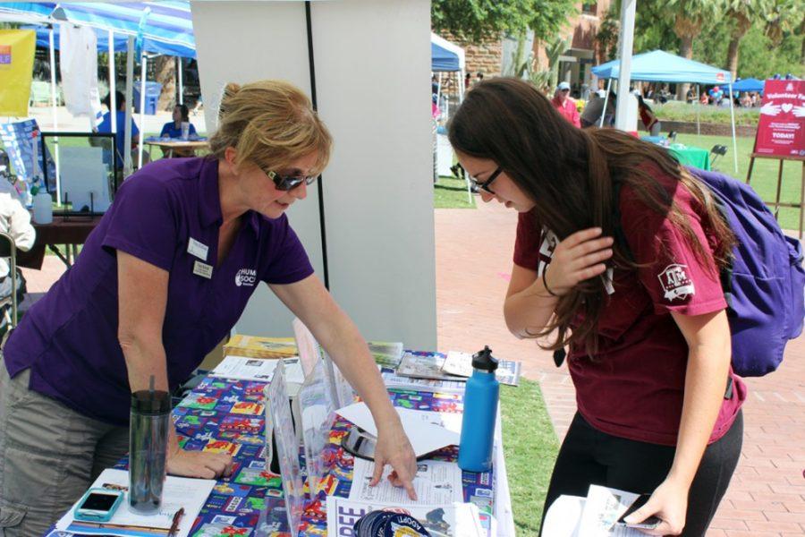 Kyle Hansen / The Daily Wildcat

Tracy Sullivan (left) of the Humane Society speaks to a student at the Volunteer Fair on the U of A mall on Sept. 24, 2014. Sullivan is the volunteer coordinator for the Humane Society in Tucson.
