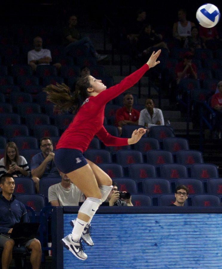 	Arizona senior libero Ronni Lewis (1) jump serves the ball during Arizona’s 3-0 win against UMBC in McKale Center on Saturday. Lewis and the Wildcats open Pac-12 Conference play against ASU on Wednesday in McKale Center. 