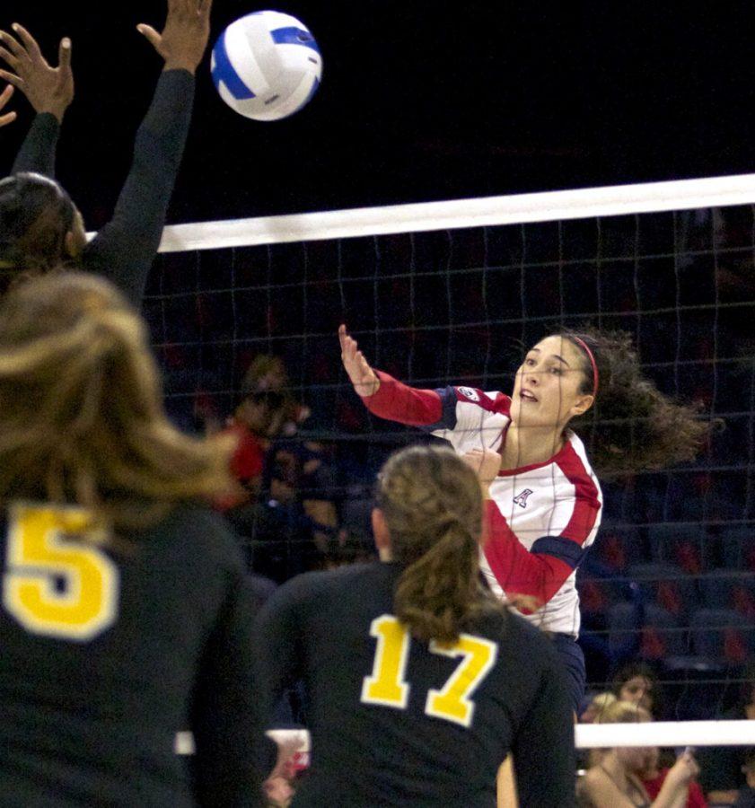 	Arizona senior outside hitter Taylor Arizobal (14) spikes the ball during Arizona’s 3-0 win against UMBC in McKale Center on Saturday. The Wildcats swept their three weekend games to close out nonconference play.