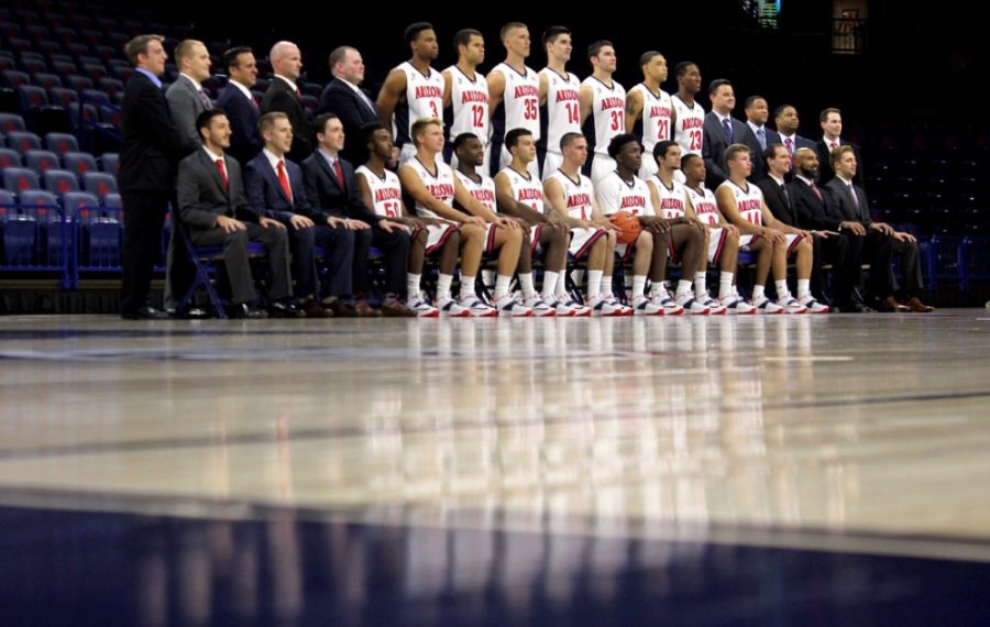 The Arizona mens basketball team poses for its 2014-15 team photo in McKale Center on Oct. 3. Both players and coaches are preaching family and cohesiveness as the 2013-14 season opener looms.
