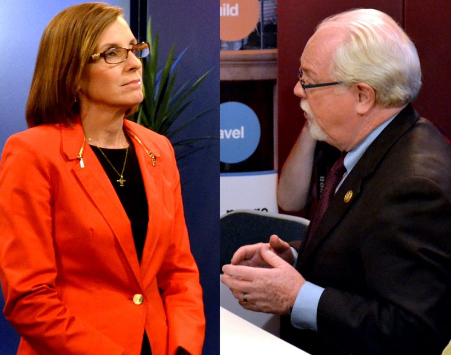 Congressional canidates Rep. Ron Barber (D) and Martha McSally (R) speak to media members after a debate in Arizona Public Media studios on Tuesday. The combatitive debate was centered around the economy, border security and gun control.