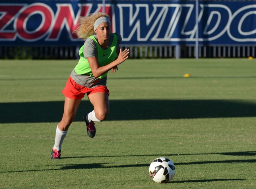 Arizona junior defensive midfielder Alexa Montgomery (20) during a scrimmage at practice on Tuesday at Murphey Field at Mulcahy Soccer Stadium. Montgomery goes by her self-given nickname, ʺGolden Blondie,ʺ due to her curly blonde hair.