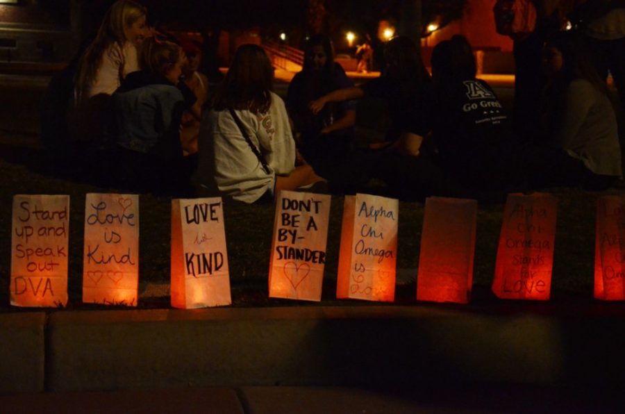 Rebecca Noble /  The Daily Wildcat

Members of Alpha Chi Omega set out luminaries with anti-domestic abuse sentiments on the UA mall on Tuesday, Oct. 14. All funds raised by the sorority will go to benefit Emerge! Center Against Domestic Abuse