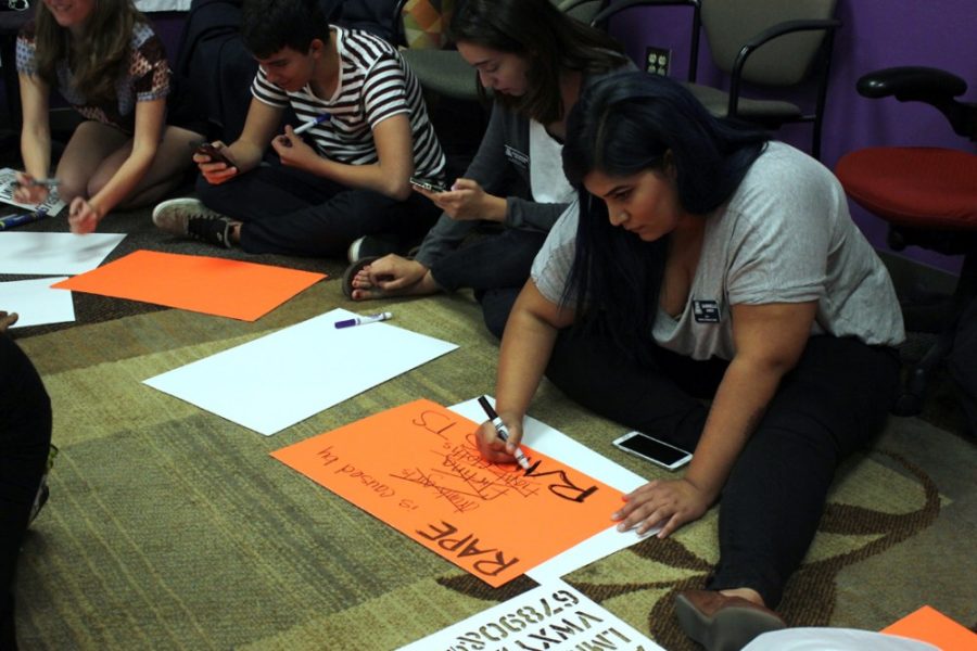 <p></p><p>Students create signs in the Women's Resource Center to address the concept of slut-shaming and what the word ʺslutʺ implies at the Sip n' Bitch event on Wednesday. The posters made will be displayed during SlutWalk Tucson on Saturday. The SlutWalk is an inclusive event meant to create a hate-free environment.</p>