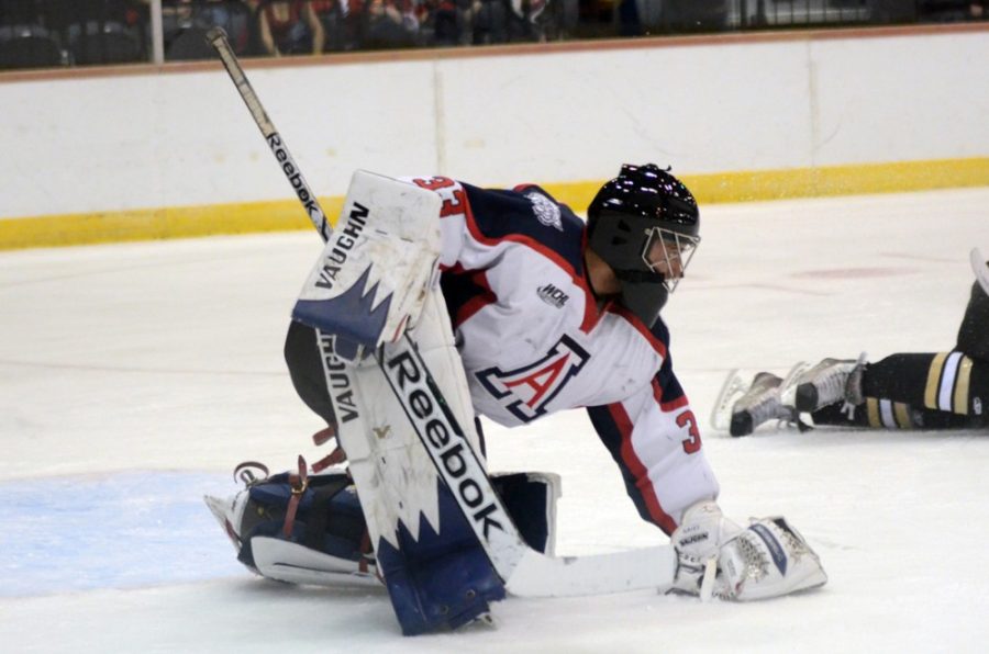 Arizona goalie Austin Wilson (33) makes one of many saves during Arizonas 3-1 win against the University of Colorado at the Tucson Convention Center Arena on Saturday. The Wildcats went 1-2 over the weekend but ended a six-game losing streak on Saturday.