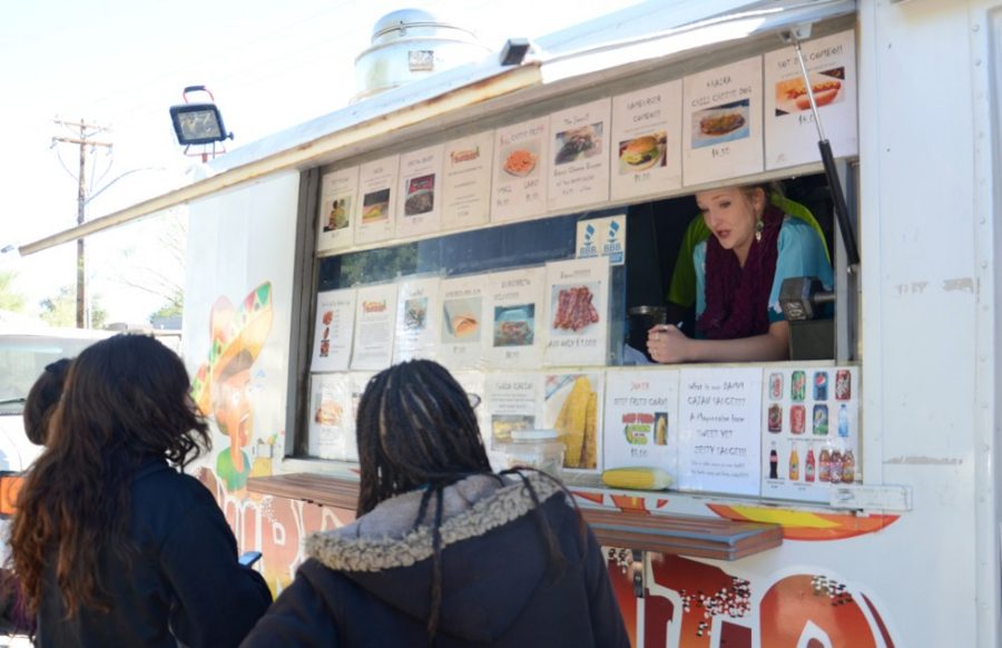 <p></p><p>Cashier Savanna Graves explains what a burgerrito is to patrons at the BurgerRito food truck on Thursday. BurgerRito is the first food truck to have its own app and is one of the most followed Tucson food trucks on social media.</p>