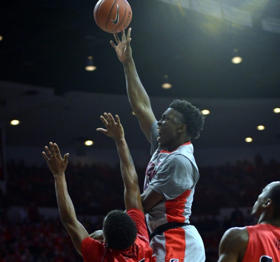 Arizona mens basketball forward Stanley Johnson (5) shoots during Arizonas 91-65 win against Gardner-Webb on Tuesday in McKale Center. Fresh off being named the Pac-12 Conference Player of the Week, Johnson put up 18 points against the Runnin Bulldogs.