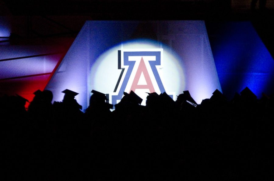 Members of the Class of 2014 during the UA 150th commencement ceremony at Arizona Stadium on May 17. According to a report by Complete College, the UA four-year graduation rate is above the national average graduation date.