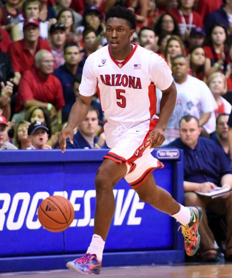 Courtesy of Matthew Thayer / The Maui NewsArizona forward Stanley Johnson dribbles down the court during Arizonas 72-68 win against Kansas State at the EA Sports Maui Invitational in the Lahaina Civic Center in Maui, Hawaii, on Nov. 25. Johnson and the Wildcats take on Gardner-Webb on Tuesday for the first time in program history.