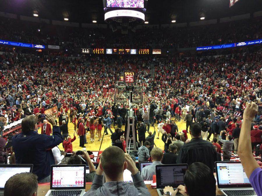 Fans storm the court at the Thomas and Mack Center in Las Vegas after the UNLV Runnin Rebels upset the No. 3 Arizona Wildcats 71-67 on Tuesday. The loss ends Arizonas 39-game regular season non-conference win streak that was the longest mark in the nation. 