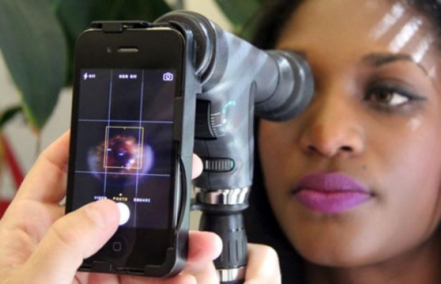 Courtesy of Pete Brown/UA College of EngineeringProfessor Wolfgang Fink is developing ophthalmic examination devices similar to the one shown here that attach to smartphones for health care providers to conduct eye exams in the field.