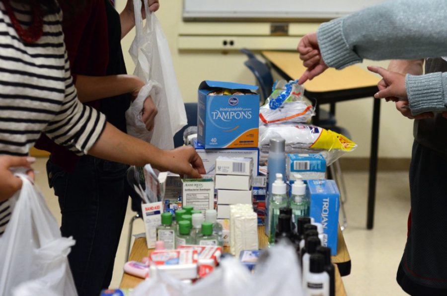 Members of the Secular Student Alliance put together care packages full of personal hygiene products tobe donated to the homeless during the holiday season on Wednesday in the Cesar E. Chavez building.