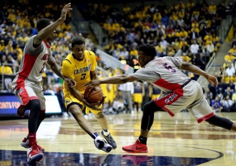Arizona forward Stanley Johnson (5) tries to knock the ball out of California guard Tyrone Wallaces (3) hands during Arizonas 73-50 win against California on Saturday at Haas Pavilion.