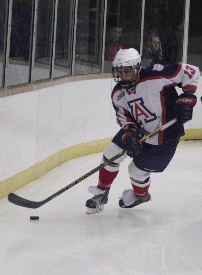 Arizona hockey forward Griffin Dyne (13) looks to score during Arizonas  5-2 loss against Stony Brook University at the Tucson Convention Center  Arena on Friday. Dyne and the Wildcats were swept over a two-game  series against Stony Brook.