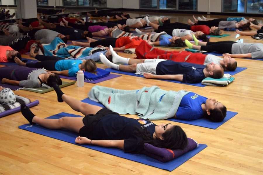 Regan Norton / The Daily WildcatStudents practice yoga nidra  breathing techniques under the direction of Leslie Langbert, executive  director for the Center of Compassion Studies, in the Student Recreation  Center on Tuesday. The class is part of the implementation efforts of  the Center for Compassion Studies to improve health.
