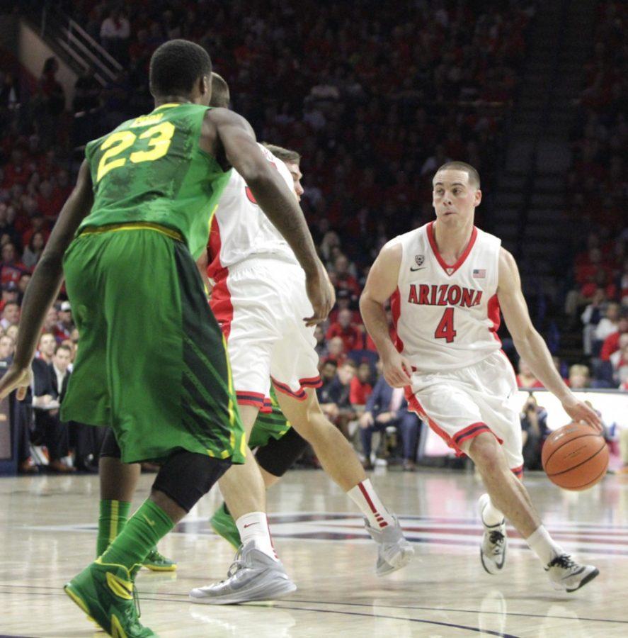 Arizona mens basketball guard T.J. McConnell (4) looks to drive past  Oregon forward Elgin Cook (23) during Arizonas 90-56 victory on  Wednesday in McKale Center. McConnell and the Wildcats take on Oregon  State on Friday in a revenge game.