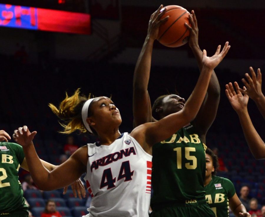 Arizona+womens+basketball+guard+Charise+Holloway+%2844%29+tries+to+block++UAB+forward+Brittany+Winbornes+%2815%29+shot+during+Arizonas+49-44+win+in++McKale+Center+on+Dec.+14%2C+2014.+Holloway+returned+to+the+Wildcats+after+sitting+out+last+season.