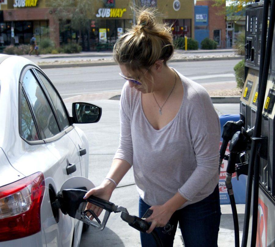 Senior student Rachel Wolfe fills up her tank on Monday at the Circle K located on Park Avenue and Speedway Boulevard. A panel will meet to discuss the changes in the price of oil from 6-8 p.m. in McClelland Hall.