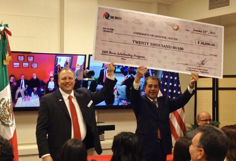 Courtesy of Sally HolcombJorge Ernesto Espejel Montes, Mexican consul in Douglas and Clint Imholte (right) holds up a giant check with the Mexican Consulate IME Becas funds contribution of $20,000 to the Education Unidos Fund.