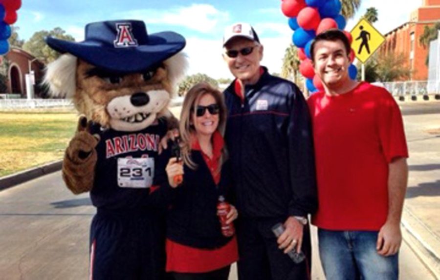 Courtesy of Adam GeyerFormer UA mens basketball head coach Lute  Olson, second from right, wife Kelly Pugnea and former Pi Kappa Alpha  fraternity philanthropy chairman Patrick Weber, far right, pose for a  photo with Wilbur Wildcat at last years Lute Olson Cancer Center Run.  Olson started the event in honor of his wife who passed away from  cancer.