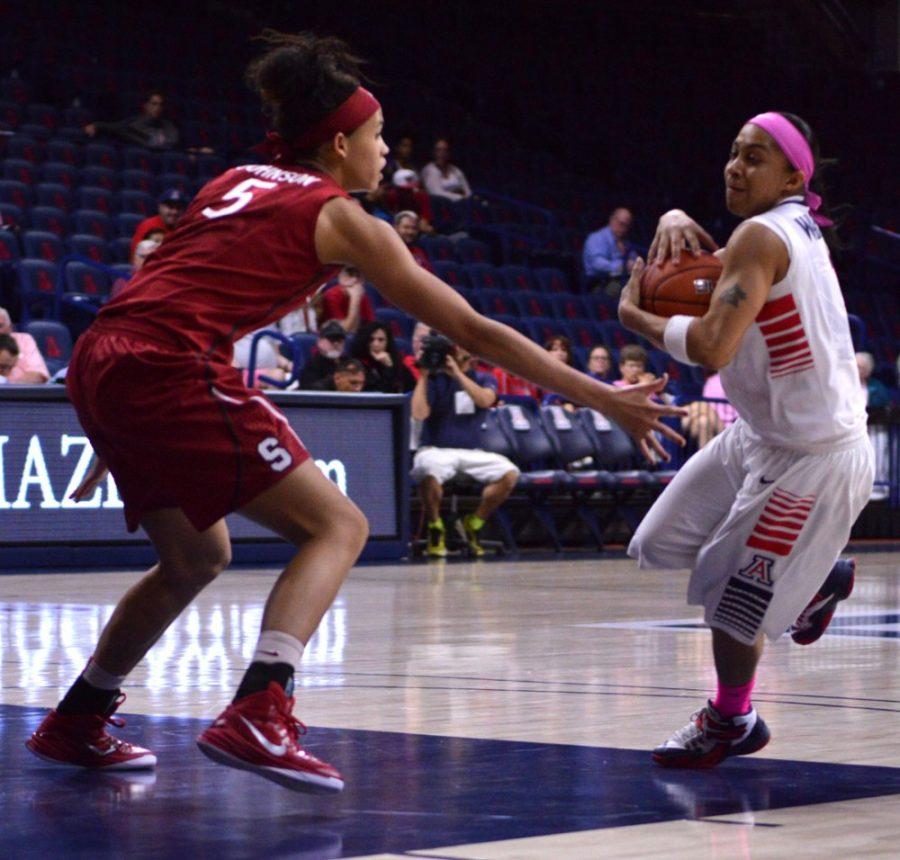 Arizona womens basketball guard Candice Warthen (1) drives to the hoop while Stanford forward Kaylee Johnson (5) defends her during Arizonas 60-57 victory over Stanford on Feb. 8 in McKale Center. Along with Alli Gloyd, Warthen is one of two seniors who will be honored on Sundays womens basketball Senior Day.