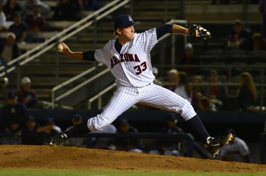 Arizona pitcher Austin Schnabel (33) whips the ball towards home plate during Arizonas opening night 7-3 win against Eastern Michigan at Hi-Corbett Field on Friday.