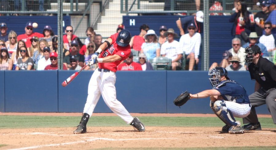 Arizona baseball catcher Riley Moore (6) hits the ball during Arizonas 6-4 extra innings loss to Rice on Sunday at Hi Corbett Field. Moore and the Wildcats host Oakland for a two-game series on Tuesday and Wednesday.