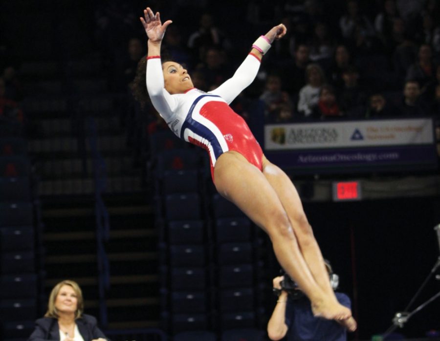 <p>Arizona gymnast Kennady Schneider flips during her floor routine during  Arizona's 197.580-196.375 loss to Utah in McKale Center on Saturday.  Schneider and the Wildcats have taken up mimicking each other's routines  as a method to improve team work.</p>