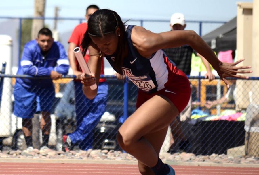 Arizona track and field sprinter Jasper Gray takes off on her leg of the 4x100 meter dash at the Willie Williams Classic at Roy P. Drachman Stadium on March 21. The Wildcats opened the outdoor portion of the season with strong performances across the board.